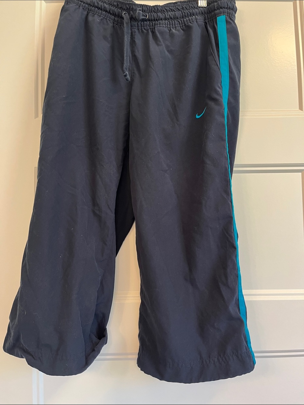 Nike women’s Navy Track Joggers with Teal Side Stripe